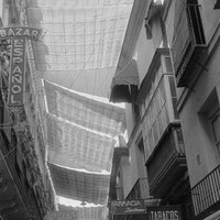 Las tradicionales velas que mitigan el calor en el centro de la ciudad como estas colocadas en la calle Sagasta. 1960-1965 ©ICAS-SAHP, Fototeca Municipal de Sevilla, fondo Serrano